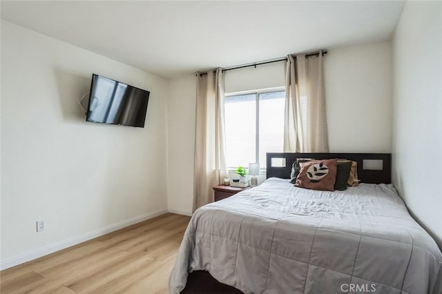 2979 Cardamon St, Rialto, CA 92376 - bedroom with wood finished floors and baseboards