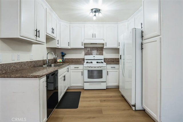 kitchen featuring white appliances, white cabinetry, under cabinet range hood, a sink, and light wood-style flooring