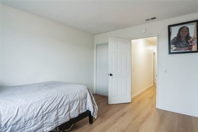 2979 Cardamon St, Rialto, CA 92376 - bedroom with light wood-style floors and baseboards
