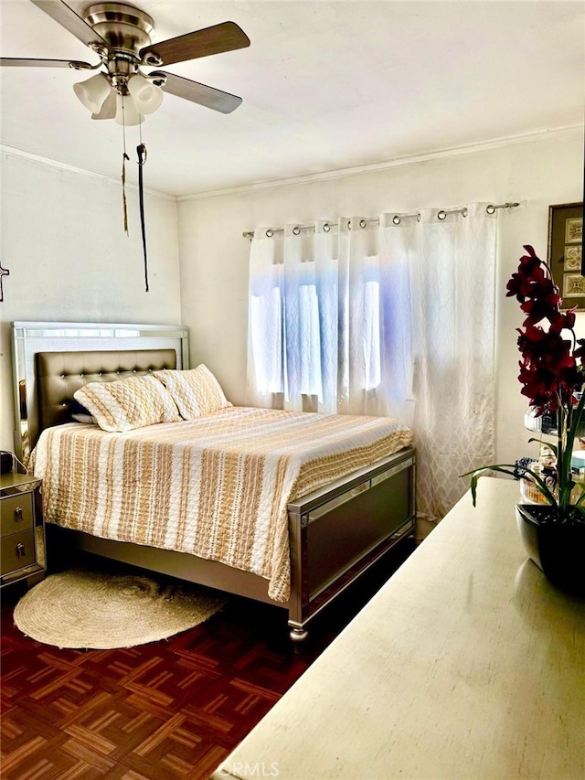 bedroom featuring dark parquet flooring and ceiling fan