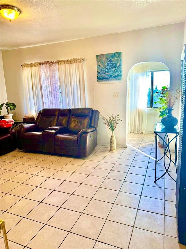 tiled living room with a textured ceiling