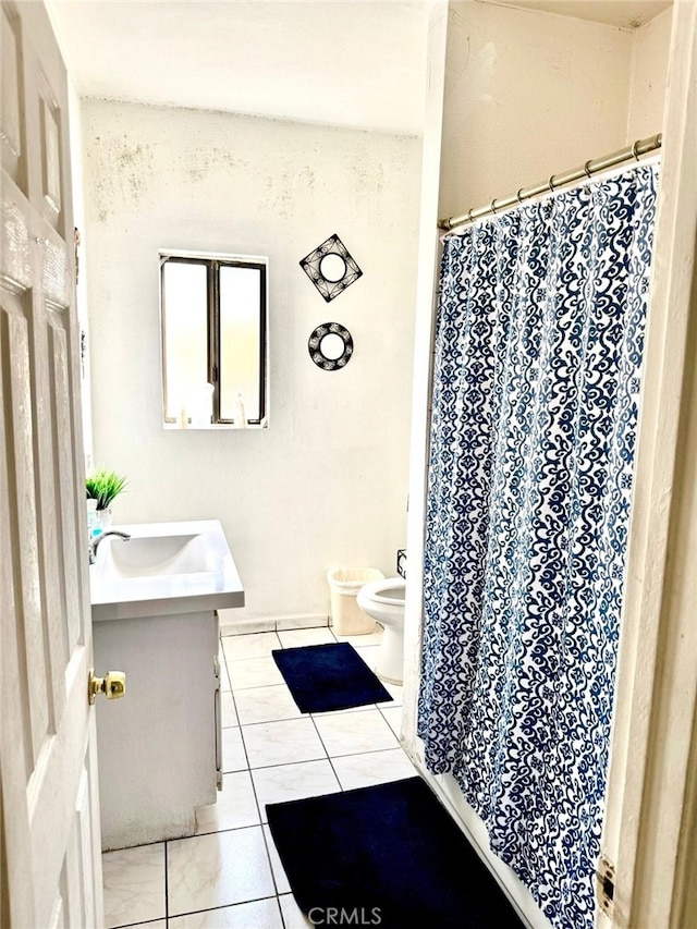 bathroom with vanity, a bidet, tile patterned floors, and toilet