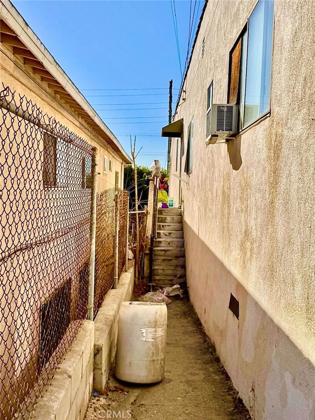 view of side of home featuring cooling unit