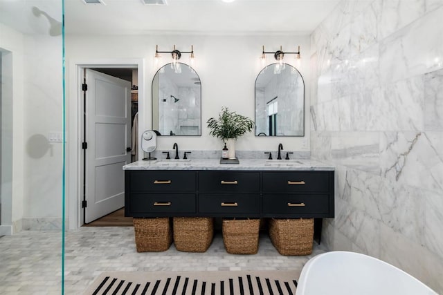 bathroom featuring tile walls, vanity, and separate shower and tub