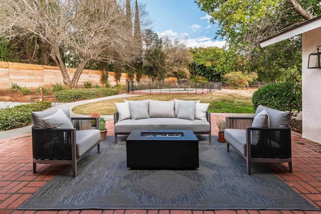 view of patio / terrace featuring an outdoor living space with a fire pit