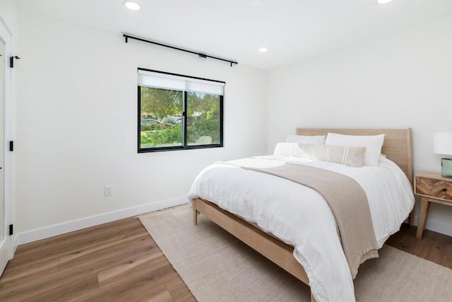 bedroom featuring wood-type flooring