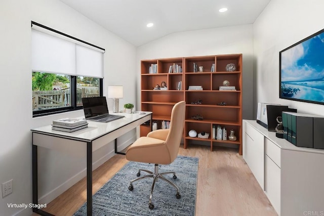 office area featuring lofted ceiling and light hardwood / wood-style flooring