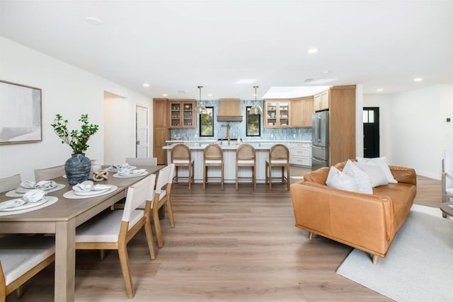 dining area featuring a wealth of natural light and light wood-type flooring