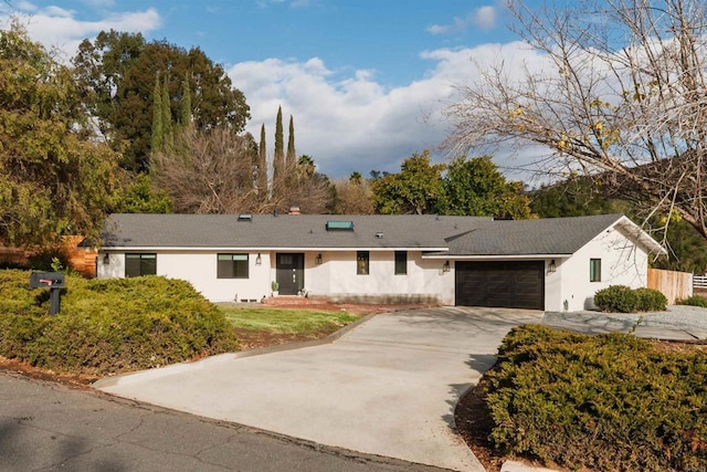 ranch-style house featuring a garage