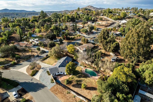 birds eye view of property featuring a mountain view