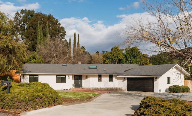 single story home featuring a garage