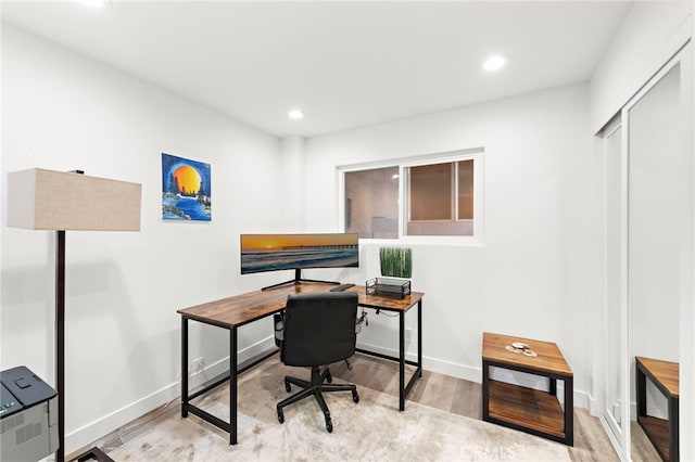 office area with light hardwood / wood-style flooring