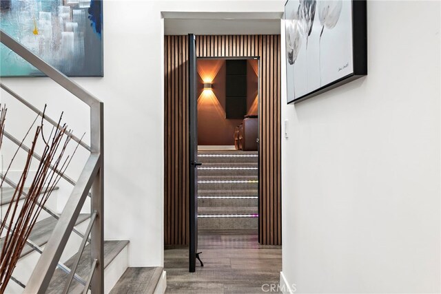 stairway featuring wood-type flooring