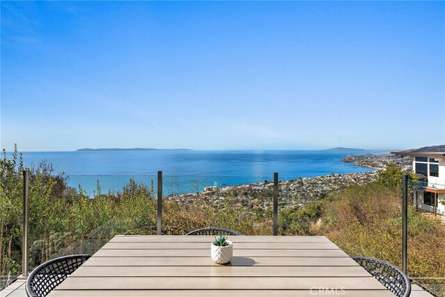 deck featuring a water view