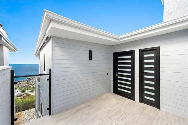 doorway to property featuring a water view