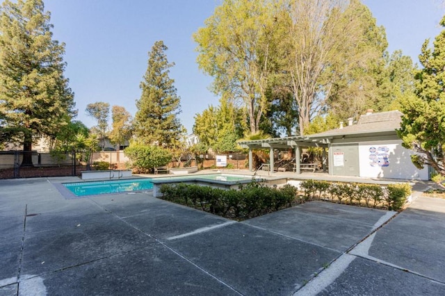 view of swimming pool with a patio