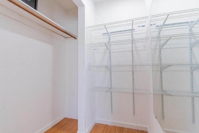 walk in closet featuring hardwood / wood-style floors