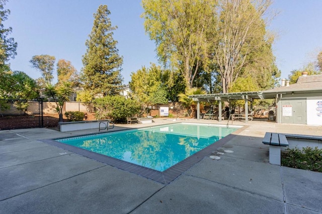 view of swimming pool featuring a pergola and a patio area