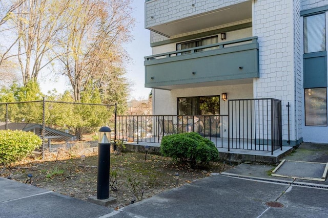 view of home's exterior featuring a balcony