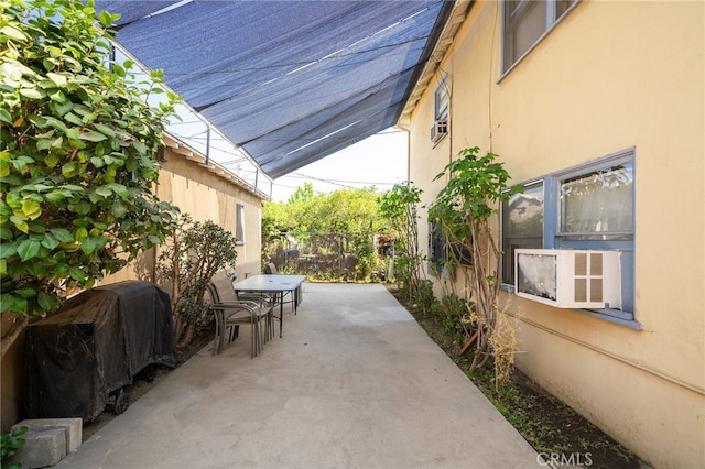 view of patio / terrace featuring cooling unit and grilling area