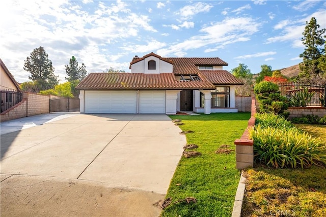 mediterranean / spanish-style house featuring a garage and a front lawn