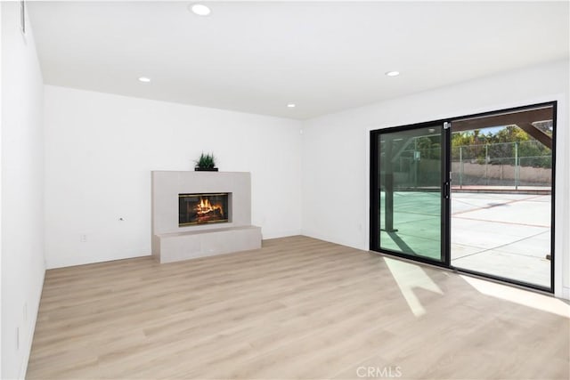 unfurnished living room featuring light hardwood / wood-style flooring