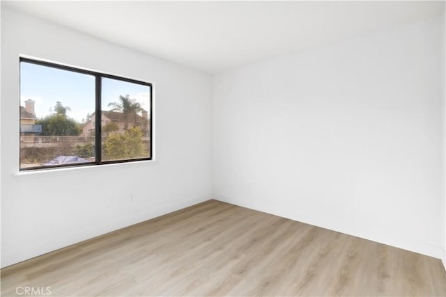 unfurnished room featuring light hardwood / wood-style floors