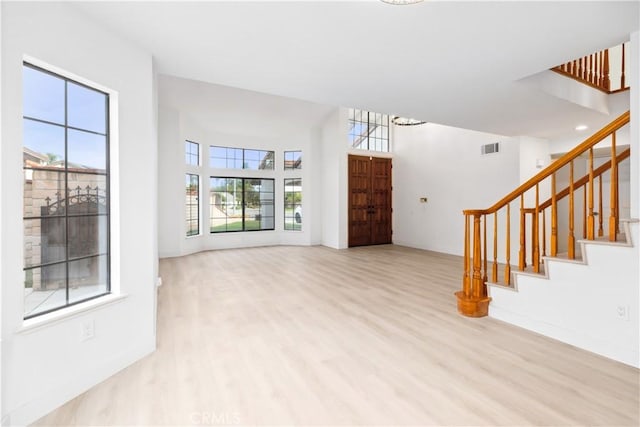 unfurnished living room featuring light wood-type flooring