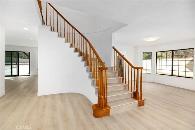 stairs with wood-type flooring