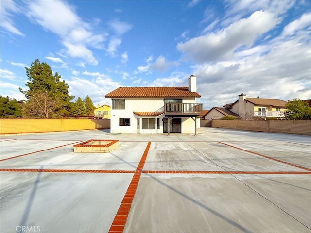 exterior space featuring a patio and a fire pit