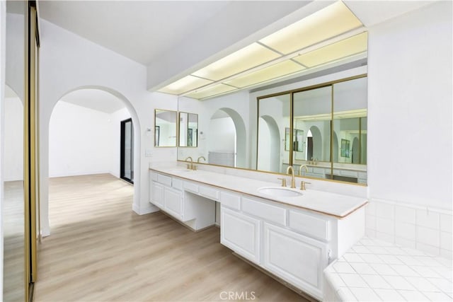 bathroom with wood-type flooring and vanity