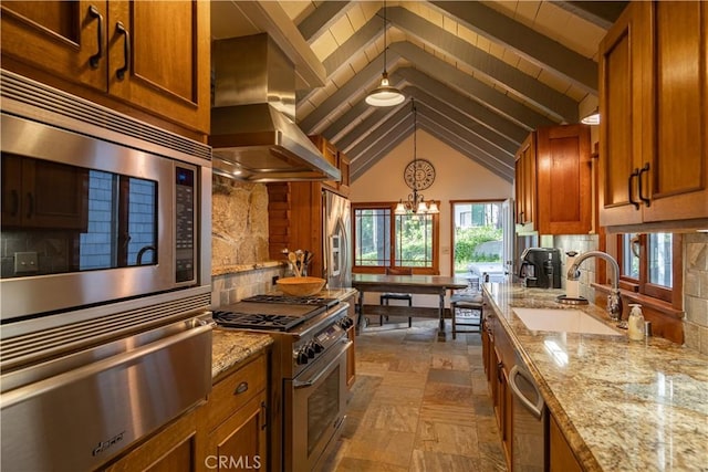 kitchen featuring tasteful backsplash, sink, stainless steel appliances, and island exhaust hood