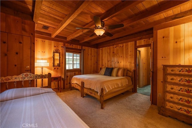 bedroom with ceiling fan, carpet, wood ceiling, and beam ceiling