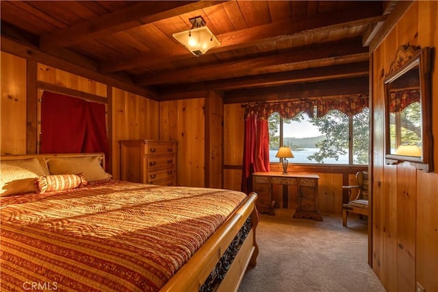 carpeted bedroom featuring wooden ceiling, beam ceiling, and wood walls