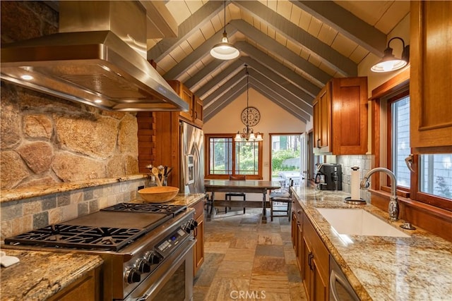 kitchen featuring pendant lighting, tasteful backsplash, sink, island exhaust hood, and stainless steel appliances