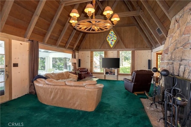 carpeted living room with wooden walls, high vaulted ceiling, beam ceiling, and a notable chandelier