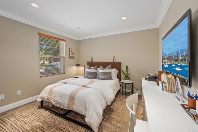 bedroom with wood-type flooring and ornamental molding