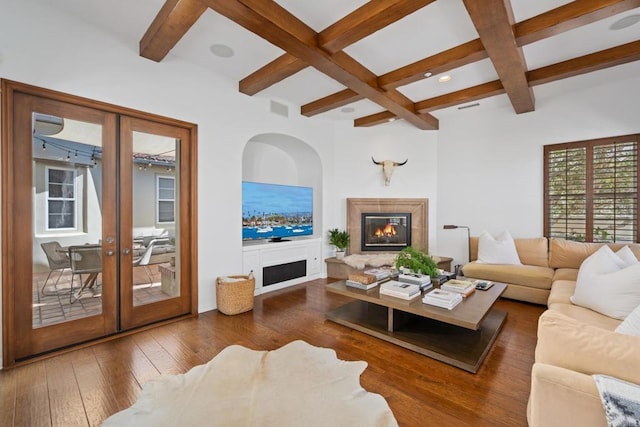 living room with beamed ceiling, dark hardwood / wood-style floors, coffered ceiling, and french doors