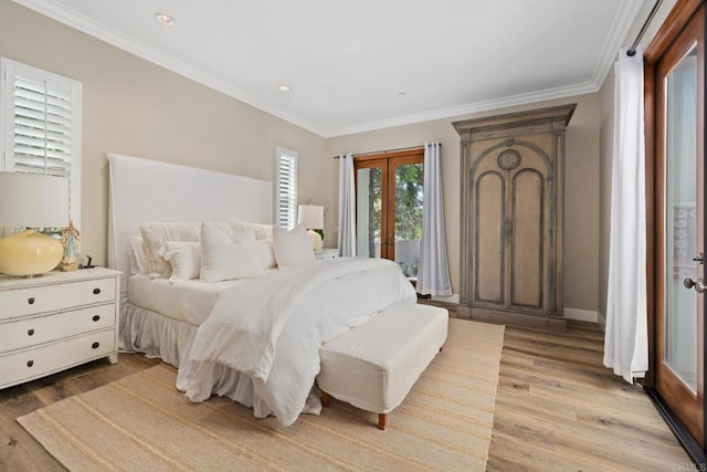 bedroom featuring light hardwood / wood-style floors, french doors, and ornamental molding