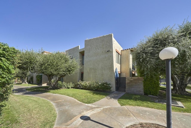 view of side of home featuring a lawn