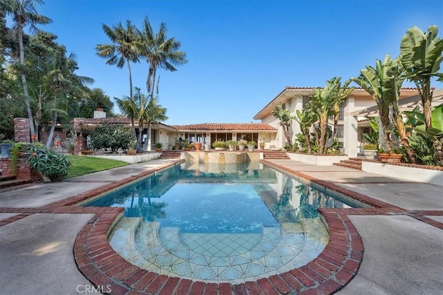 view of swimming pool featuring a patio