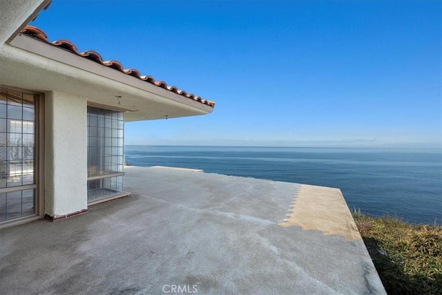 view of patio / terrace featuring a water view