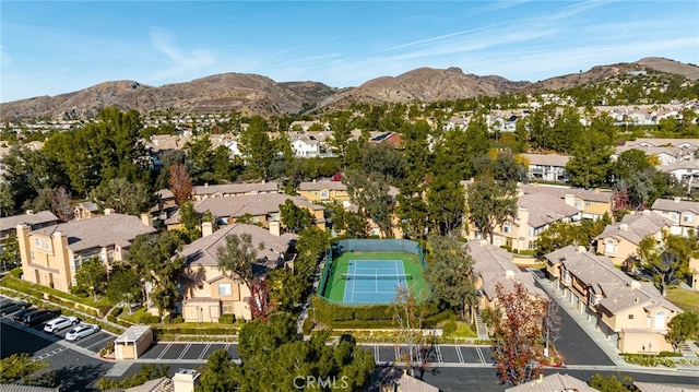 birds eye view of property featuring a mountain view