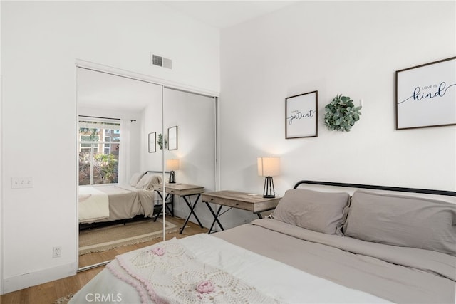 bedroom featuring a closet and light wood-type flooring