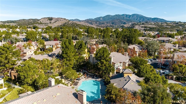 birds eye view of property featuring a mountain view