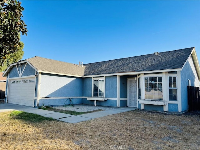 single story home with a garage