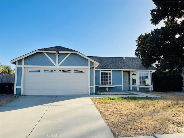 ranch-style home featuring a garage