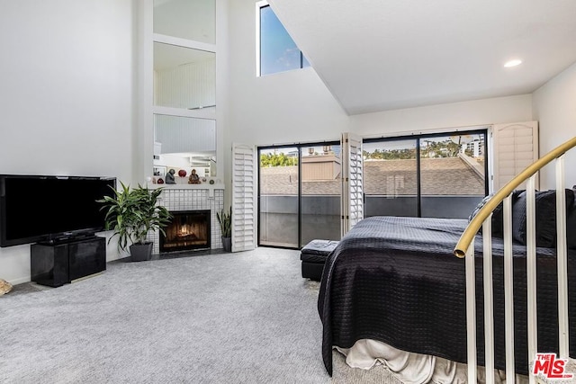 bedroom featuring carpet floors, a fireplace, and high vaulted ceiling