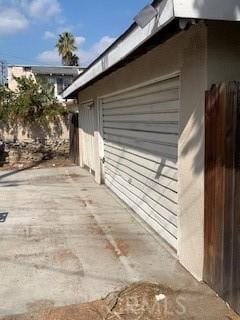 view of side of property featuring fence