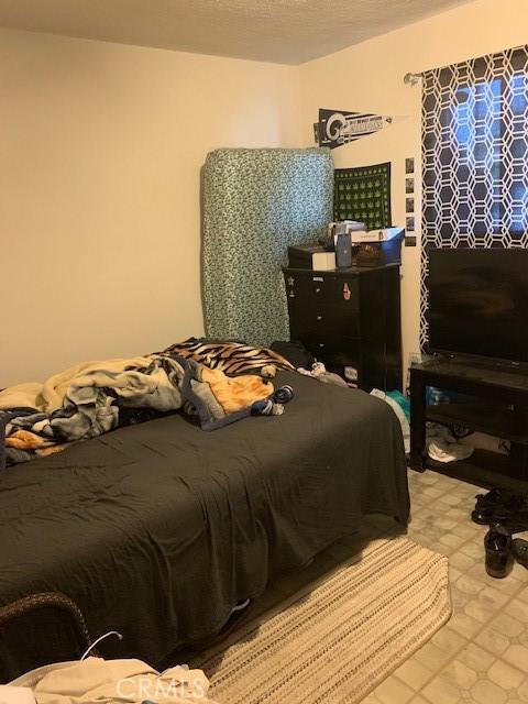 bedroom featuring tile patterned floors